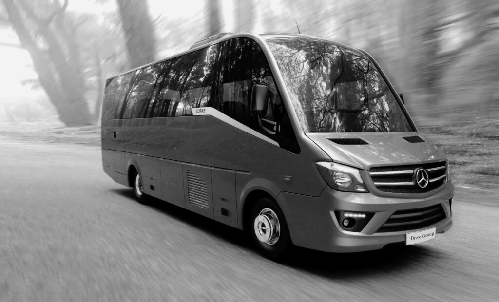 Black and white Mercedes Sprinter ready for group chauffeur transfers across Ireland